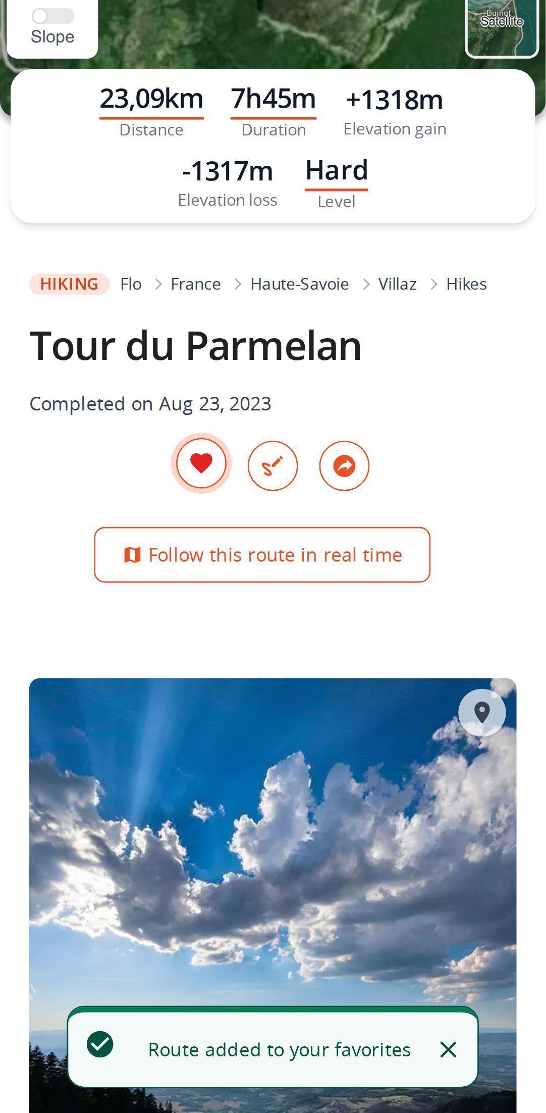 Route page on a smartphone in MapPlanner: the heart has just been tapped and turns red, with the notification that the route was added to favorites